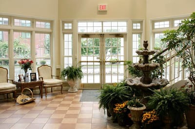Interior lobby area with seating and fountain