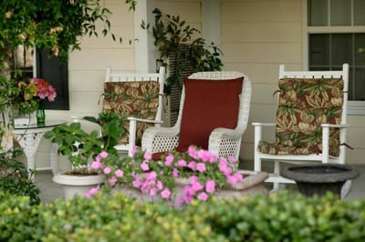 Outdoor seating area with flowers and plants
