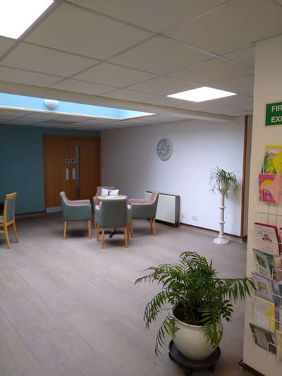 Interior common area with chairs and plants