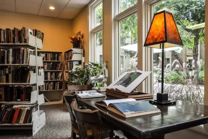 Cozy library corner with books and lamp