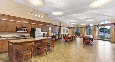 Bright common area with kitchen and seating