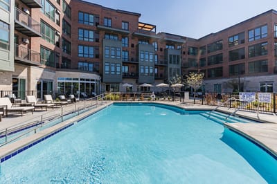 Outdoor pool area with lounge chairs