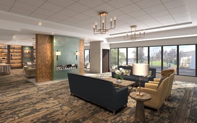 Bright and spacious common area with seating and windows
