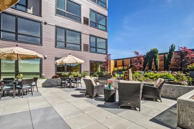 Outdoor seating area with garden at the facility