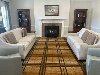 Common area with comfortable seating around a fireplace