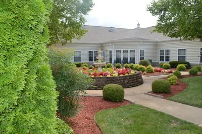 Well-maintained outdoor garden area with fountain