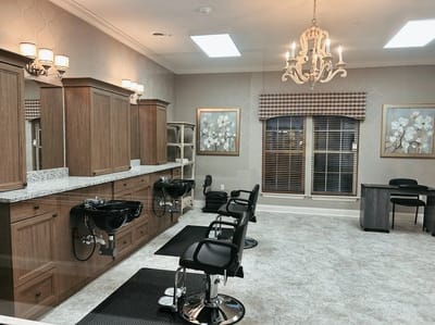 Interior view of a hair salon area with styling chairs