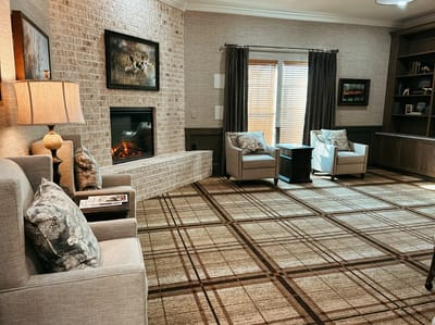 Cozy interior lounge area with seating and fireplace