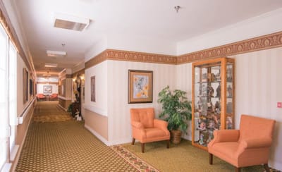 Warm and inviting interior hallway with seating