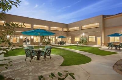 Outdoor seating area with umbrellas and greenery