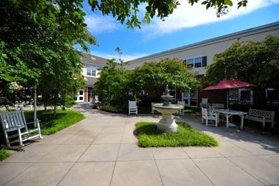 Serene outdoor courtyard with fountain and seating