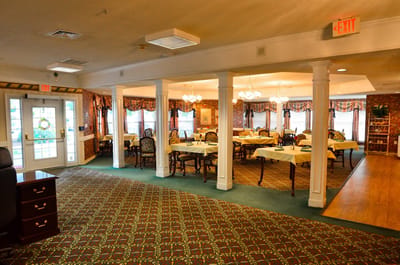 Dining area with tables and chairs in a cozy setting