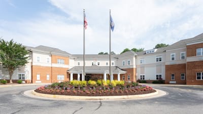 Exterior view of the Bellgrade Estates facility with flags.
