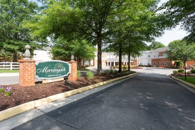 Entrance view of the facility with landscaping