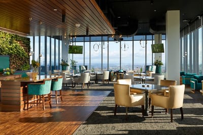 Bright common area with large windows and modern decor