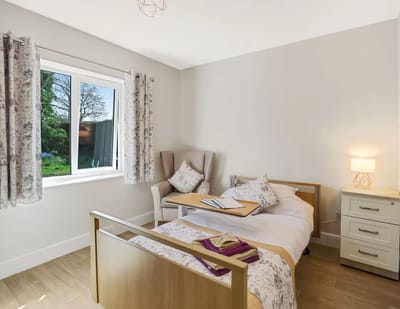 Cozy resident room with natural light and seating