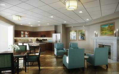 Bright common area with seating and kitchen space