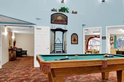 Interior common area with a pool table and seating
