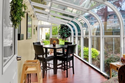Bright sunroom with table and chairs