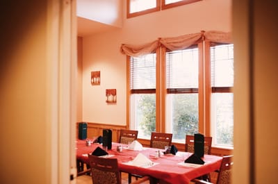Dining area with neatly arranged table settings