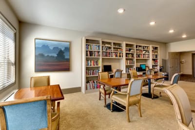Cozy common area with bookshelves and seating