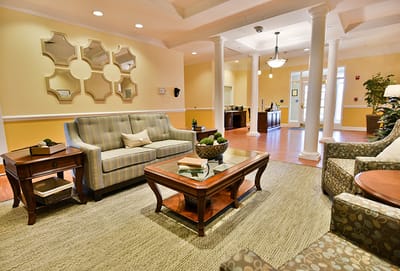 Common area with seating and tables in a warm lounge