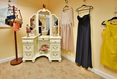 Interior fashion display with dresses and a mirror