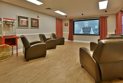 Activity room with seating and movie screen