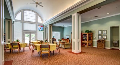 Bright interior common area with tables and seating
