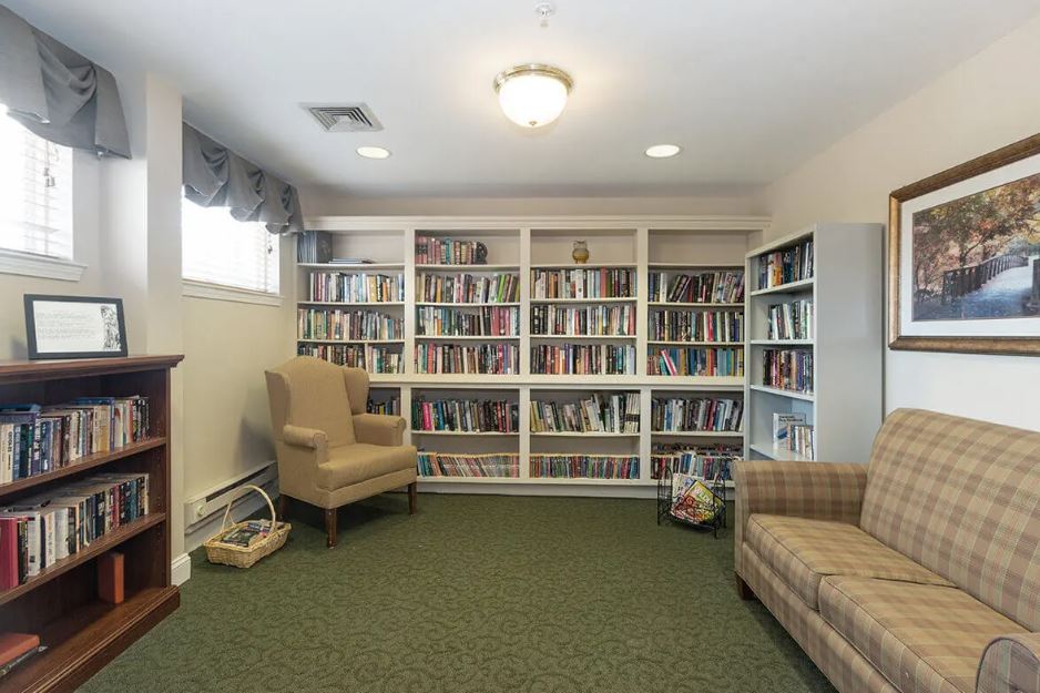 Cozy library area with bookshelves and seating