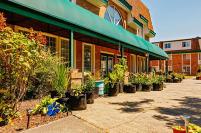 Outdoor view of the facility with garden spaces