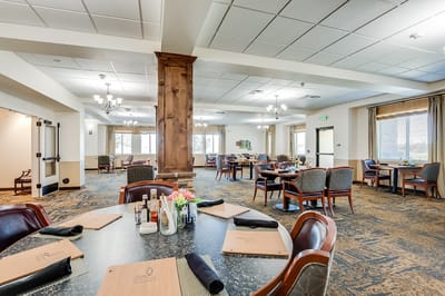 Interior view of a dining room with tables set up