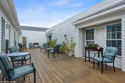 Outdoor seating area with tables and chairs