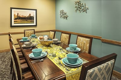 Tastefully set dining room table with decorations