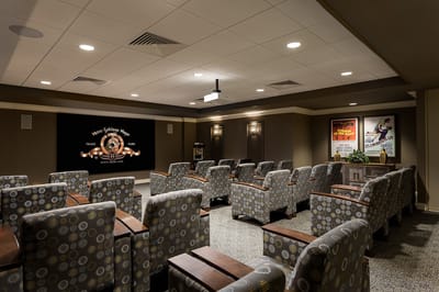 Interior view of the facility's theater room with seating
