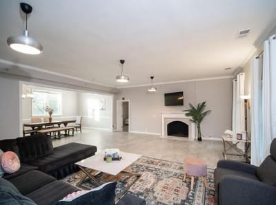 Bright common area with seating and dining space