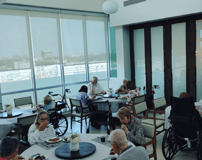 Residents enjoying a meal in the dining area