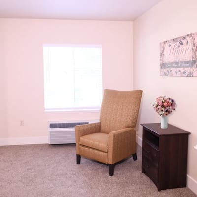 Cozy private room with a chair and decor