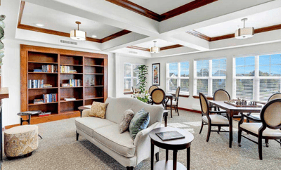 Bright common area with seating and bookshelves