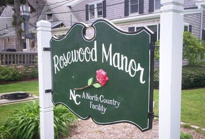 Facility logo sign of Rosewood Manor