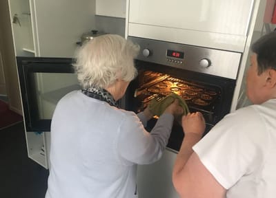 Residents baking in a kitchen