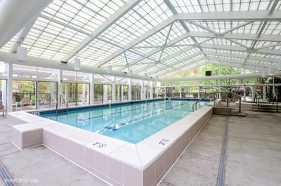 Indoor swimming pool area with bright natural light