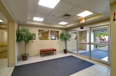 Lobby area with indoor plants and seating