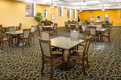 Interior view of a dining room with tables and chairs