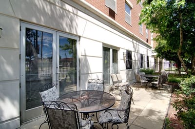 Outdoor patio area with tables and chairs