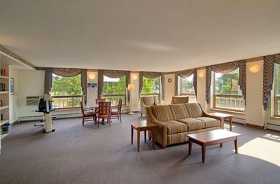 Bright common area with seating and windows