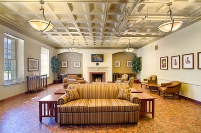 Cozy common area with seating and a fireplace