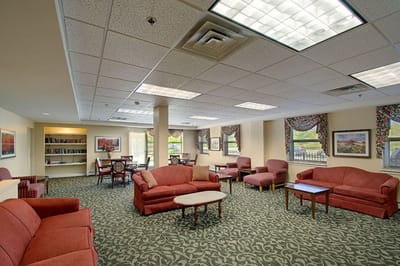 Bright common area with seating and bookshelves