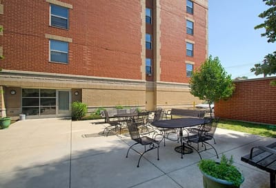 Outdoor seating area with tables and chairs
