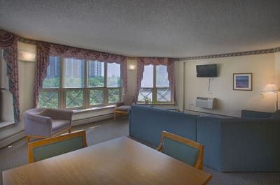 Bright common area with seating and large windows